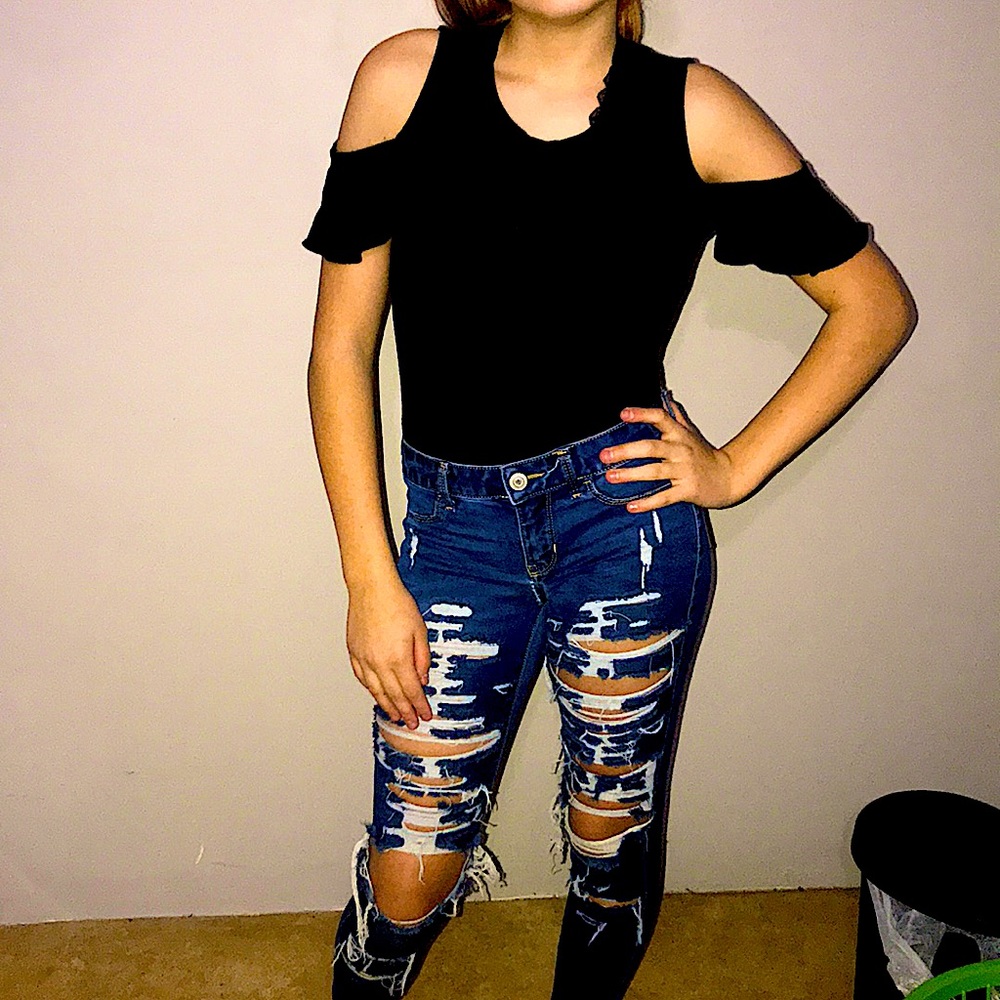 Shredded jeans off shoulder